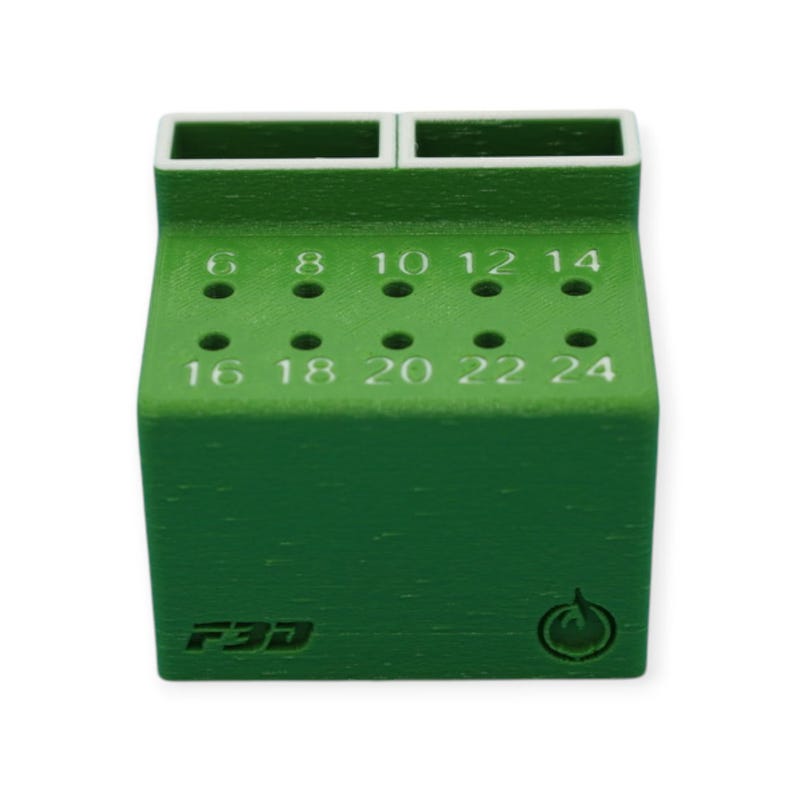 May include: A green 3D-printed tool holder with two rectangular compartments on top and numbered holes on the front. Numbers range from 6 to 24. The holder has the text "F3D" and a circular logo on the front.