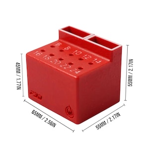May include: A red, rectangular tool holder with multiple holes and two rectangular slots. The holder is labeled with numbers from 5 to 24, and measures 2.56 inches wide, 2.17 inches deep, and 1.77 inches tall.