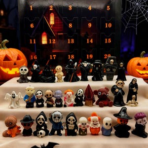 May include: A Halloween advent calendar with the text "31 Nights ~ Fright Mystery Countdown Box." It displays miniature horror character figurines. Pumpkins and a bat silhouette are also visible.