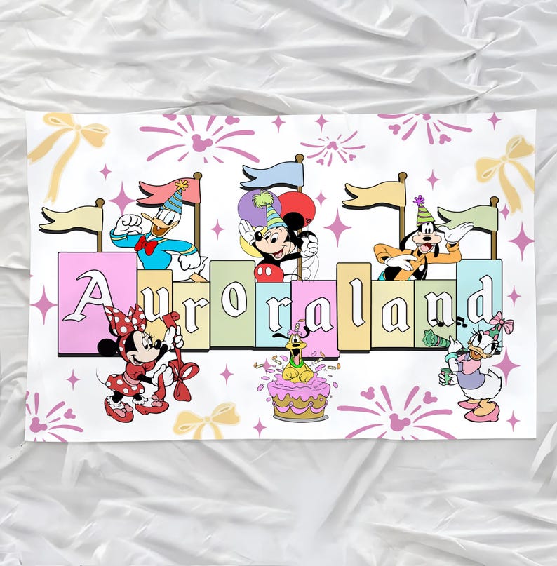 May include: A rectangular fabric banner featuring Disney characters including Mickey Mouse, Minnie Mouse, Donald Duck, Daisy Duck, Goofy, and Pluto. The text Auroraland is displayed in large letters. The design includes party hats, balloons, and fireworks.