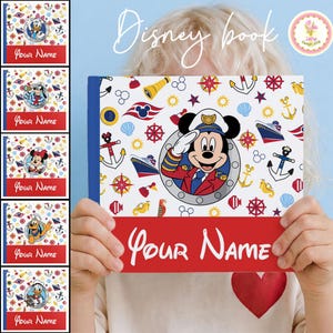 May include: A Disney-themed book with a red and white cover featuring Mickey Mouse in a captain's uniform. The cover is decorated with nautical elements like anchors, ships, and compasses. The text "Your Name" is written in a cursive font on a red banner.