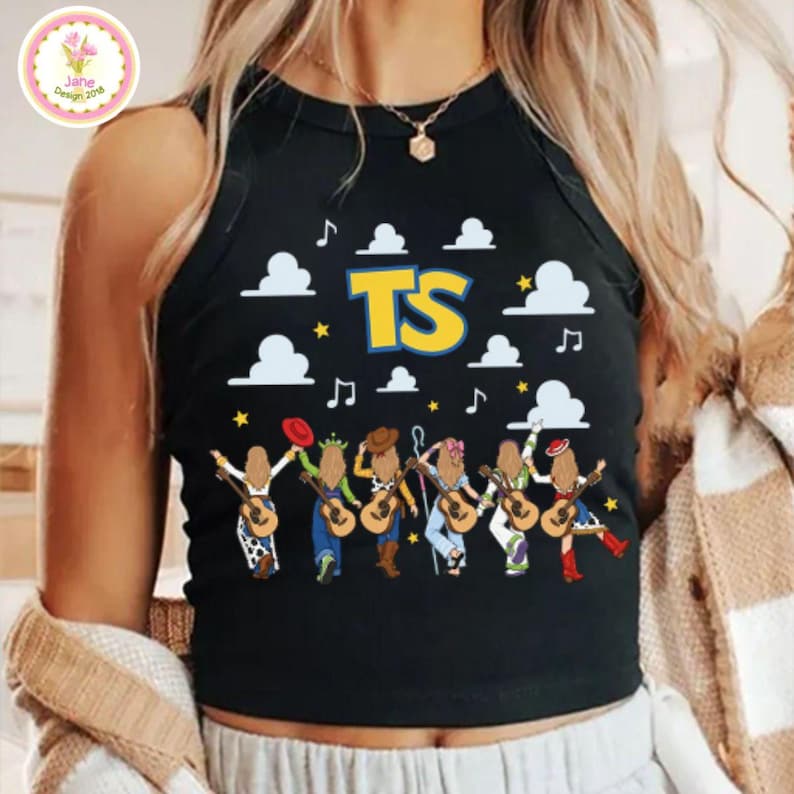 May include: A black sleeveless tank top featuring a graphic print of six cartoon figures with long hair playing acoustic guitars. The design includes white clouds, yellow stars, musical notes, and the large yellow letters TS centered at the top.