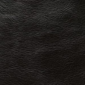 May include: Close-up of a textured black leather surface. The leather has a slightly glossy finish and a pattern of fine wrinkles and subtle variations in tone, creating a rich, detailed appearance. The overall effect is one of depth and sophistication.