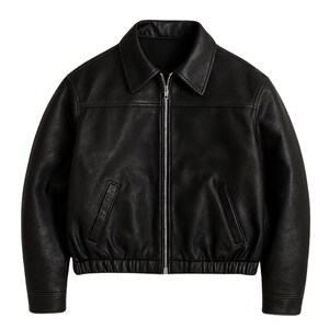 May include: A black leather jacket with a collared neckline and a silver zipper closure. The jacket features two front pockets and ribbed cuffs and hem. This outerwear piece is a classic style.