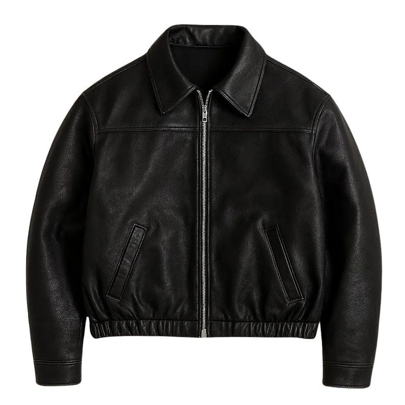 May include: A black leather jacket with a collared neckline and a silver zipper closure. The jacket features two front pockets and ribbed cuffs and hem. This outerwear piece is a classic style.