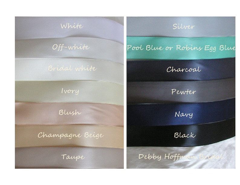 May include: A selection of satin ribbon colors for wedding decorations.  The colors include white, off-white, bridal white, ivory, blush, champagne beige, taupe, silver, pool blue or robin's egg blue, charcoal, pewter, navy, and black.