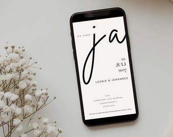 May include: A smartphone displaying a wedding invitation with the text WIR SAGEN ja, 22 JULI 2027, LEONIE & JOHANNES, 15:00, STANDESAMT HAUS SEVERING, DURENSTRASSE 11, STADTLOHN, and a small sprig of white baby's breath flowers next to the device.