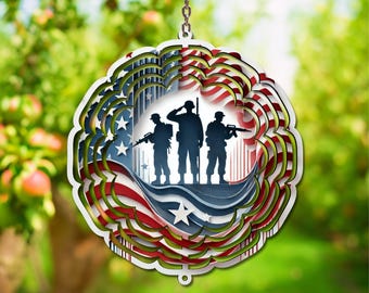 May include: A layered, circular ornament featuring a patriotic design. The ornament showcases the American flag with red and white stripes, blue stars, and silhouettes of soldiers. It hangs from a chain, suitable for display.