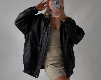 Vintage zwart leren bomberjack: oversized echt leer uit de jaren 90