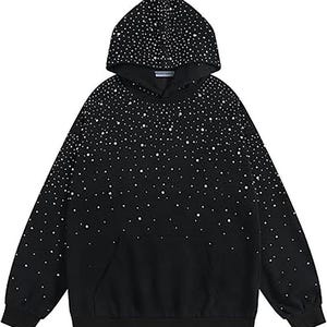 May include: Black hoodie with a white dot pattern, featuring a hood and a front pocket. The white dots are densely packed at the top and gradually fade towards the bottom. The hoodie is made of a soft material.