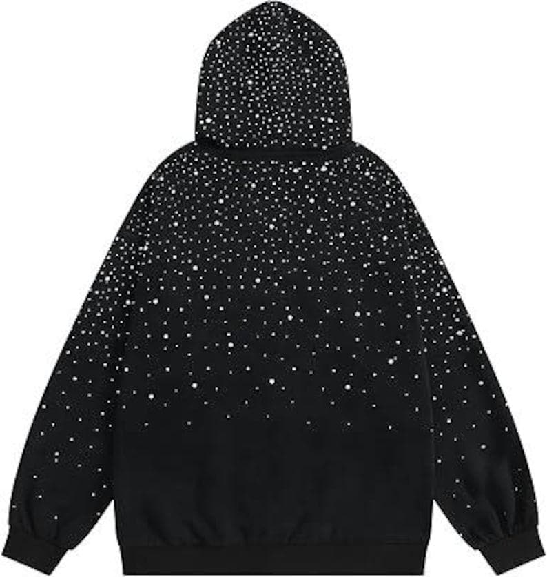 May include: Black hoodie with a white dot pattern that fades from the hood down. The hoodie has a drawstring hood, long sleeves, and a ribbed hem and cuffs. The design gives the appearance of a starry night sky.