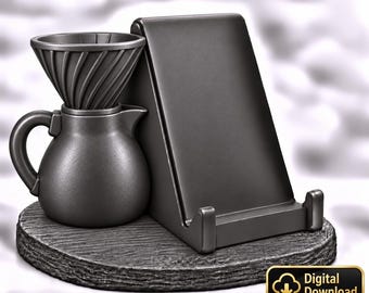 Könnte beinhalten: Ein dunkelgraues Kaffeebereiter-Set mit einem konischen Filteraufsatz auf einer kleinen Kanne, platziert neben einem Tablet- oder Handyhalter auf einer runden, texturierten Basis. Ein kleines Schild zeigt den Text Digital Download.