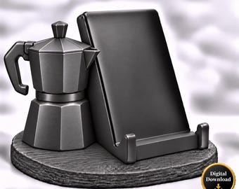 Könnte beinhalten: Ein mattschwarzes Schreibtisch-Accessoire mit einer stilisierten Moka-Kaffeekanne, die an einem rechteckigen Handy- oder Tablet-Ständer befestigt ist, auf einem runden, strukturierten Sockel. Ein goldenes Abzeichen zeigt Digital Download.