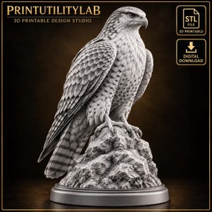 May include: A 3D printable STL file design of a falcon perched on a textured rock. The sculpture features detailed feathers and a sharp beak. The text PRINTUTILITYLAB 3D PRINTABLE DESIGN STUDIO and STL FILE 3D PRINTABLE DIGITAL DOWNLOAD are visible.
