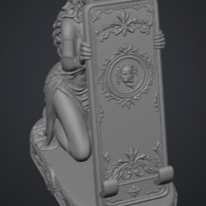 May include: A gray monochromatic sculpture of a kneeling figure with long wavy hair holding a rectangular tablet. The tablet features a central circular relief of a cherub face, ornate floral carvings, and two small curved supports at the base.