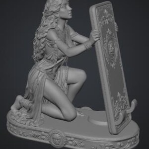 May include: A gray resin figurine of a kneeling figure with long flowing hair, wearing a draped garment and jewelry. The figure holds a tall, rectangular, ornate frame with a central circular emblem, all set upon an oval base with floral carvings.