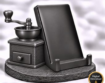Könnte beinhalten: Ein dunkelgrauer Handyhalter im Design einer Miniatur-Kaffeemühle mit Kurbel und kleiner Schublade auf einem runden Sockel. Der Halter hat eine glatte, geneigte Fläche für ein Gerät und enthält ein Digital Download-Symbol.