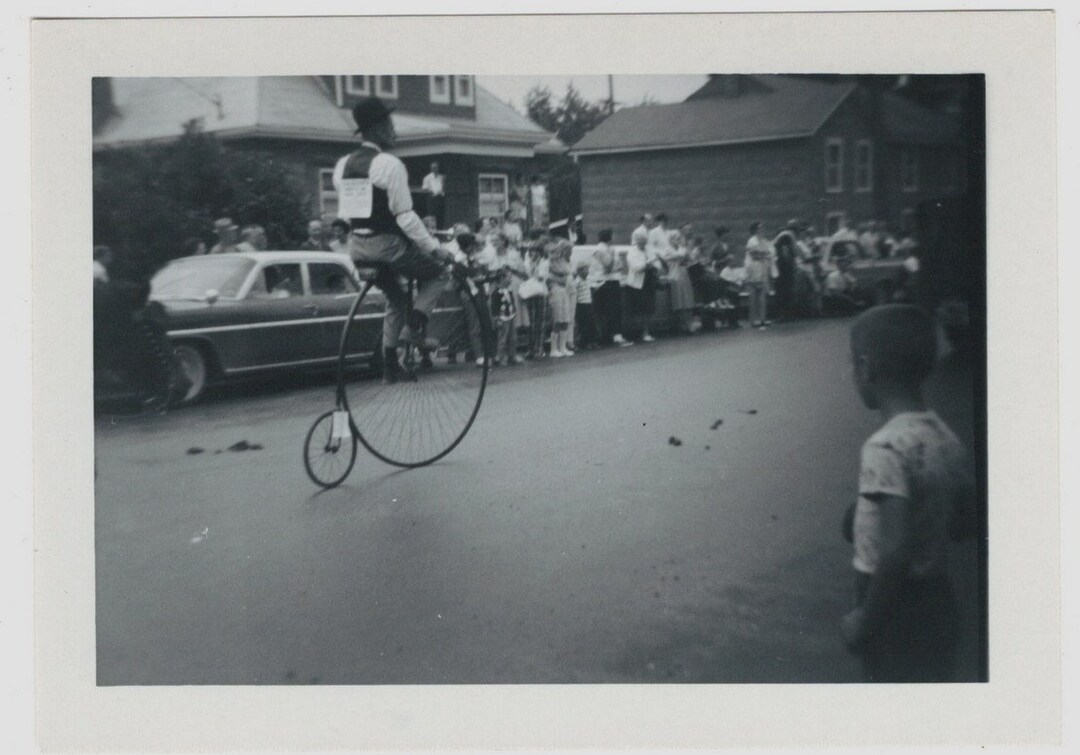 Snapshot Photo Man Riding Penny Farthing in Parade 1967 Vintage