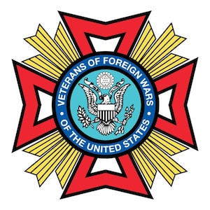 May include: A circular emblem featuring the text "Veterans of Foreign Wars of the United States" encircling a central design. The emblem has a red cross shape with yellow rays, and a blue circle with an eagle and shield.
