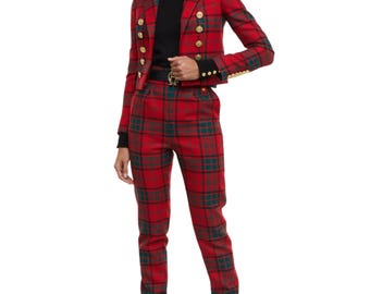 May include: A red plaid blazer and matching pants set. The blazer has gold buttons and a cropped fit. The pants are a slim fit. The outfit is a bold fashion statement.