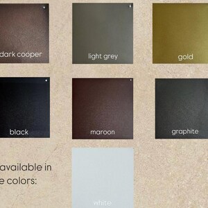 May include: A color chart featuring square metal samples in dark copper, light grey, gold, black, maroon, and graphite. Additional colors available include white. Text indicates the colors available.