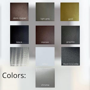 May include: A color palette chart displaying ten square swatches labeled dark copper, light grey, gold, black, maroon, graphite, natural steel, white, black crocodile, and chrome. The word Colors is printed in black text at the bottom left.