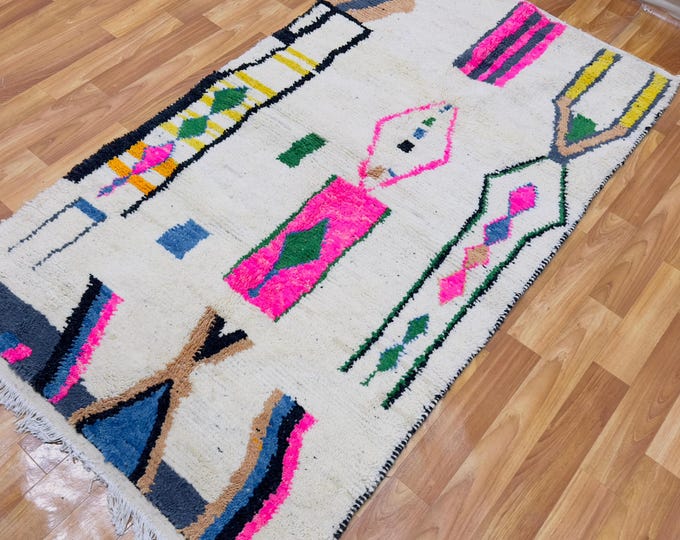 Handwoven Berber Wool Rug: Creamy Ivory with Neon Pink Tribal Motifs
