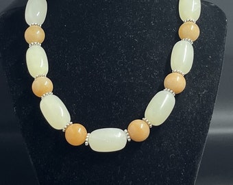 Cream Oval and Tan beaded necklace with Metal accent beads