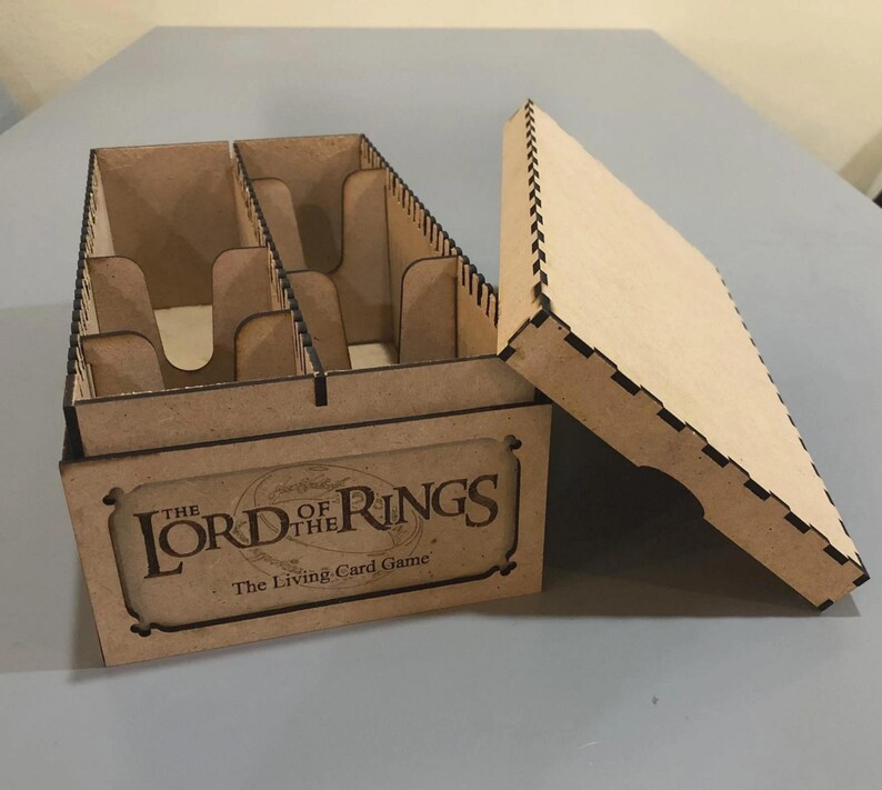 A cardboard box with a lid, labeled "The Lord of the Rings: The Living Card Game"