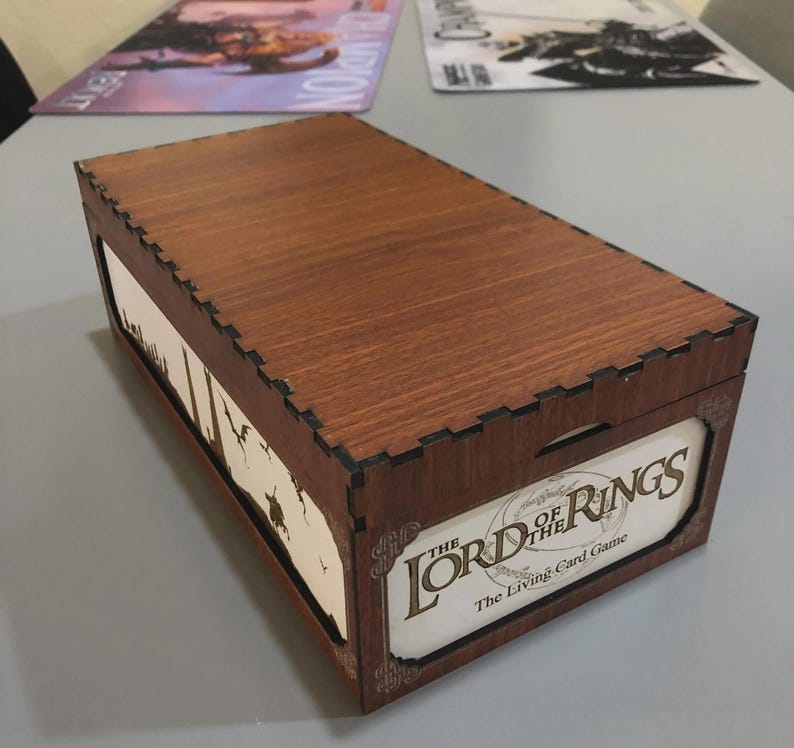A wooden box with the title "The Lord of the Rings" printed on it, sitting on a table.