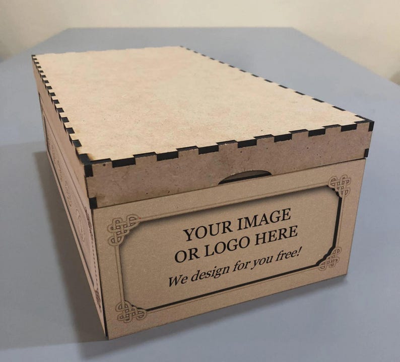 A cardboard box with a lid and a decorative border, featuring a message that says "YOUR IMAGE OR LOGO HERE" and "We design for you free!"