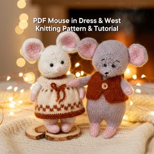 May include: Two knitted mouse dolls are shown, one white and one grey. The white mouse wears a cream dress with a brown pattern. The grey mouse wears a brown vest. The text "PDF Mouse in Dress & West Knitting Pattern & Tutorial" is at the top.
