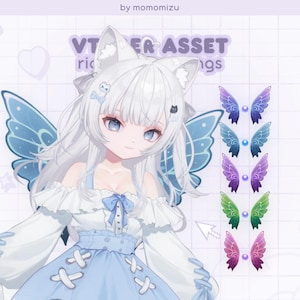 Puede incluir: Ilustración digital de un personaje con cabello blanco, orejas de gato y ojos azules, adornado con alas de mariposa azules. La imagen incluye varios diseños de alas de mariposa coloridas en tonos azules, morados, verdes y rosas, para activos digitales.