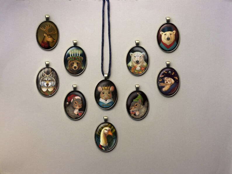May include: A set of 10 oval-shaped ornaments featuring various animals wearing hats and clothing. The ornaments are made of metal and have a brown finish. The animals include a reindeer, a wolf, a squirrel, a goose, a polar bear, a mouse, a dog, and a bear.