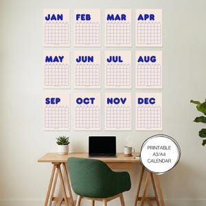May include: Twelve monthly calendars with grid layouts, each labelled in bold blue text, are displayed on a wall. A desk with a laptop, mug, and chair is in front of the calendars. The image includes the text "PRINTABLE A3/A4 CALENDAR."