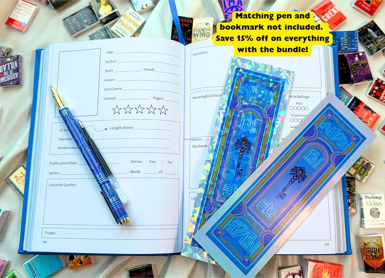 May include: An open blue journal with a detailed layout, a blue pen, and two decorative bookmarks featuring a key design. The journal is surrounded by miniature books. The text on the bookmarks reads "END".