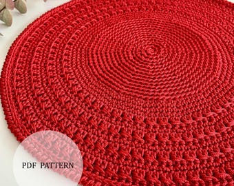 May include: A vibrant red, circular crochet doily. The handmade piece features concentric circles of textured stitches, with a detailed edge. The text "PDF PATTERN" is visible in a white circle. This item is perfect for home decor.