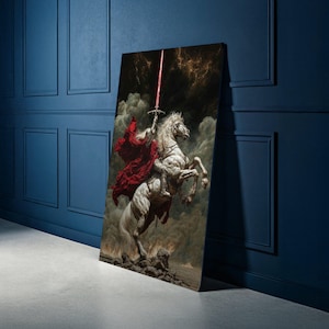 May include: A canvas print depicting a knight on a rearing white horse, holding a glowing red sword. The knight wears a red cloak, set against a dramatic, stormy sky and fiery landscape. The artwork leans against a blue wall.