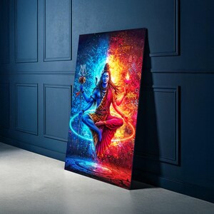 May include: A colourful canvas print of a Hindu deity, split vertically with blue and red tones. The deity is shown with multiple arms, holding symbolic items. The artwork has intricate details and a spiritual theme, suitable for home decor.