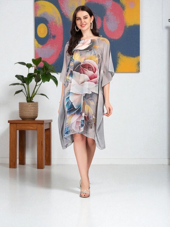 stylish kaftan dress design This is an elegant Velvet kaftan . The design is modern and stylish,  crafted with soft velvet fabric. It features golden detailing at the center  and pleated accents at the waist, adding
