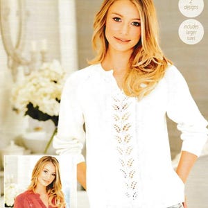 May include: A woman wearing a white knitted sweater with a leaf pattern down the front. The image includes the text "Linen Drape" and sizing information in inches and centimeters. The sweater design includes larger sizes.