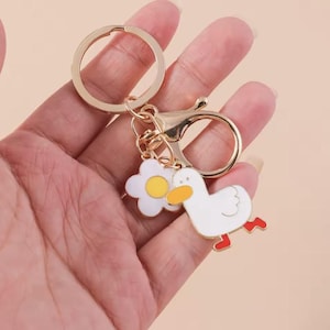 Lindo llavero de pato esmaltado: abalorio de animal de dibujos animados para mujer y hombre, accesorio para bolso, llavero de coche, idea de regalo divertida.