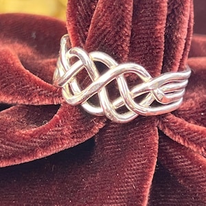 Anillo rompecabezas pesado de 4 piezas en plata de ley imagen 1