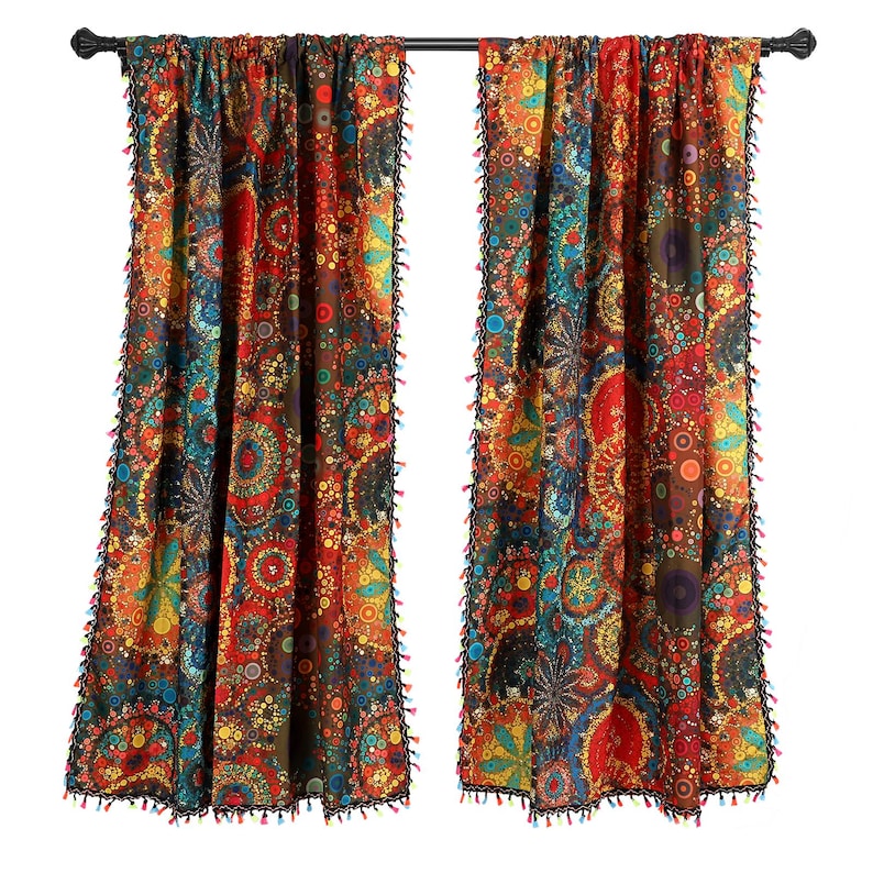 May include: Two colorful patterned curtains with a black rod. The curtains feature a vibrant design with red, orange, blue, and yellow hues. Black tassels line the edges. Home decor.
