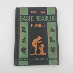 May include: A vintage "Basic Readers Primer" book with a black cover and green accents. The cover features the text "Elson-Gray" and "Basic Readers Primer" in white and orange. Illustrations of animals and children are also present.