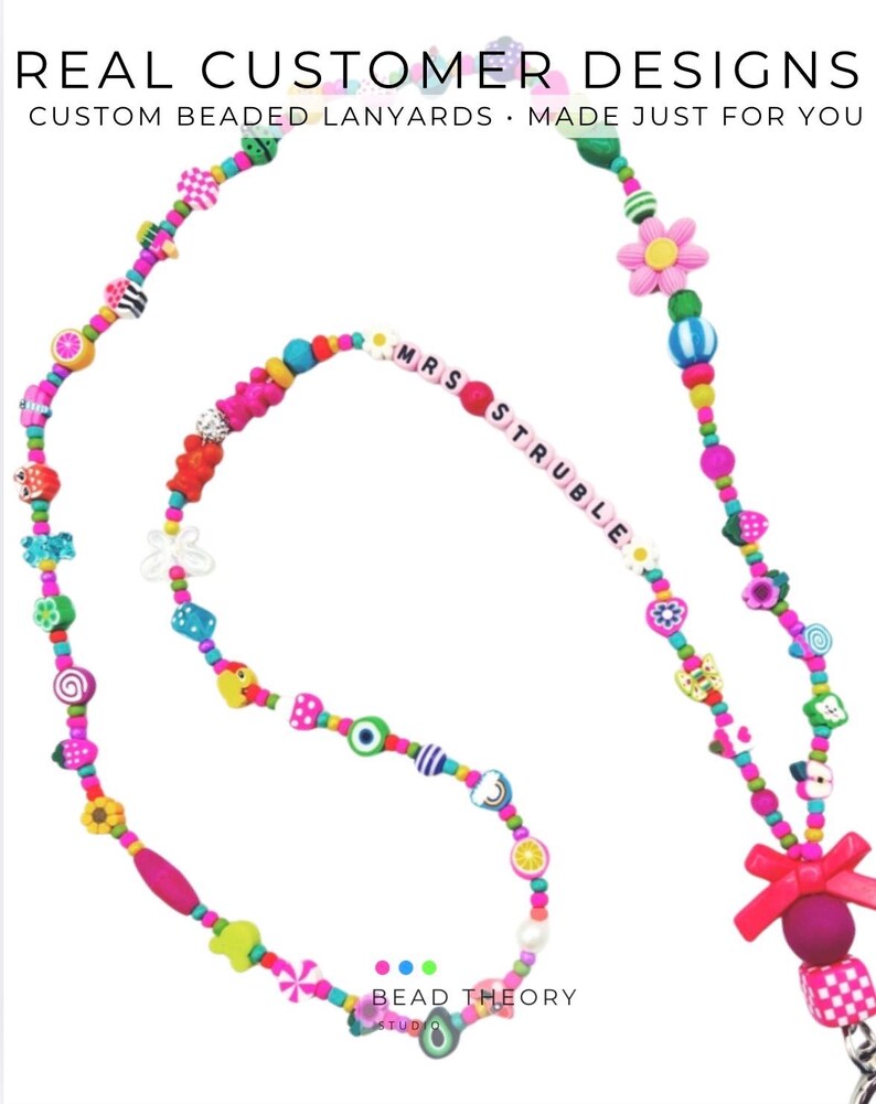 May include: A colorful beaded lanyard featuring a variety of shaped beads including flowers, fruits, and geometric patterns. The text "MRS STRUBLE" is spelled out in white letter beads. A bright pink bow and a metal clasp are attached at the end.