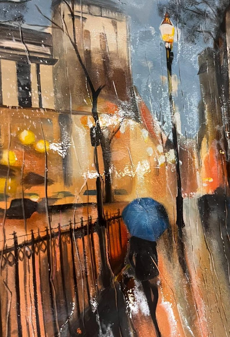 May include: Oil painting depicting a rainy street scene. A person with a blue umbrella walks along a wrought iron fence. Buildings and streetlights are visible in the background, with warm orange and yellow tones contrasting with the cool blues and greys of the rain.