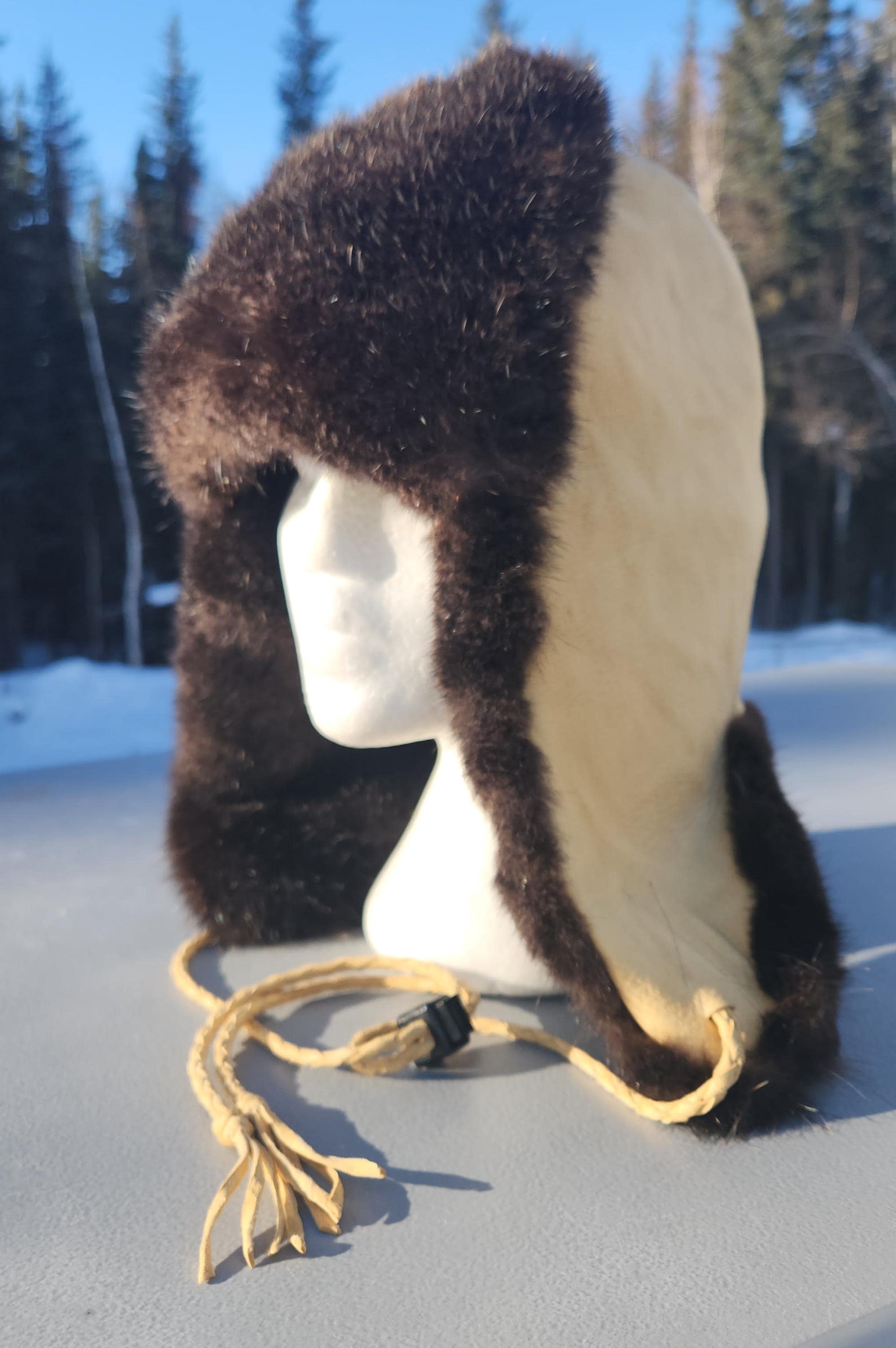 Handmade warm and cozy winter hat made with real fur and leather made in  North Pole, Alaska, image size:1994x3000