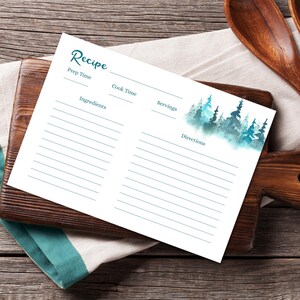 May include: White recipe card with teal text and a watercolor forest design. The card includes sections for prep time, cook time, ingredients, servings, and directions. The word "Recipe" is at the top.