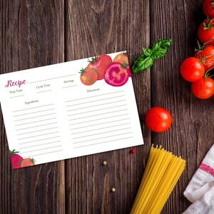 May include: A recipe card with watercolor tomatoes and the word "Recipe" in pink script. Fresh tomatoes, basil, and spaghetti are arranged on a dark wood surface, suggesting a culinary theme. The card has space for prep time, ingredients, and directions.